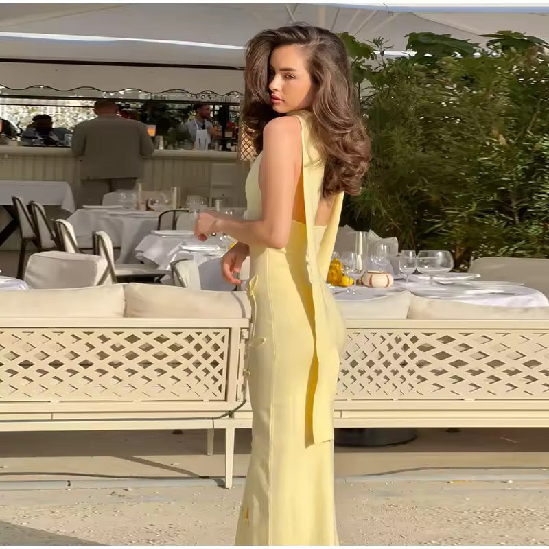 Dames mouwloze maxi-jurk met halternek en diepe V-hals met strikapplicaties