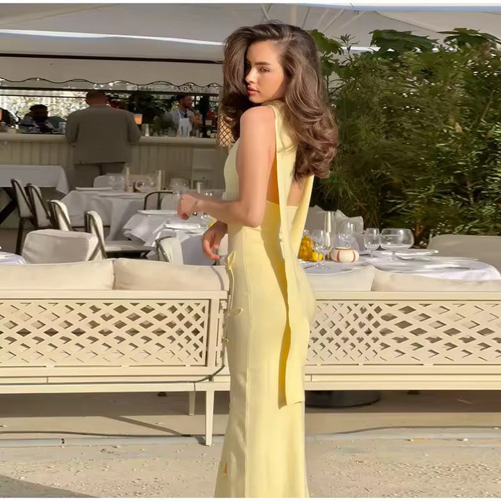 Dames mouwloze maxi-jurk met halternek en diepe V-hals met strikapplicaties