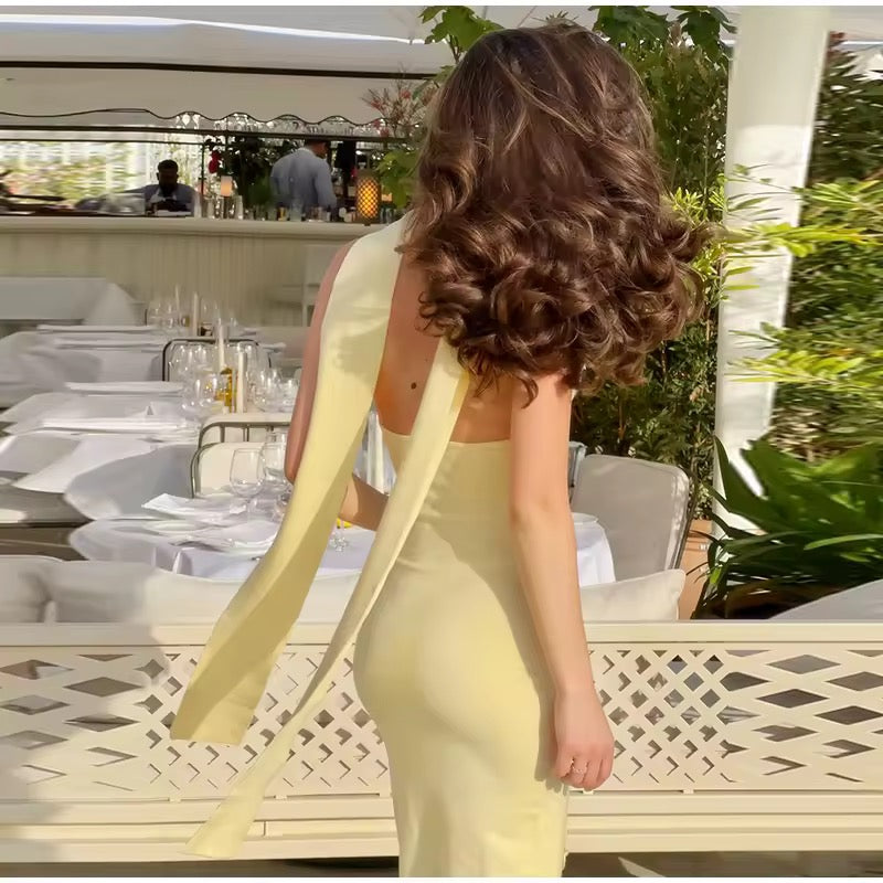 Dames mouwloze maxi-jurk met halternek en diepe V-hals met strikapplicaties