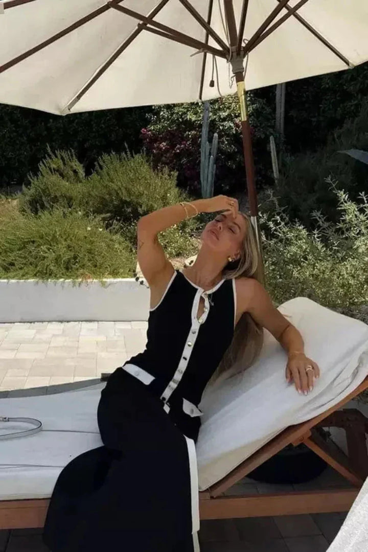 Dames mouwloze midi-jurk met ronde hals, knoopsluiting, klepzakken en contrasterende biezen