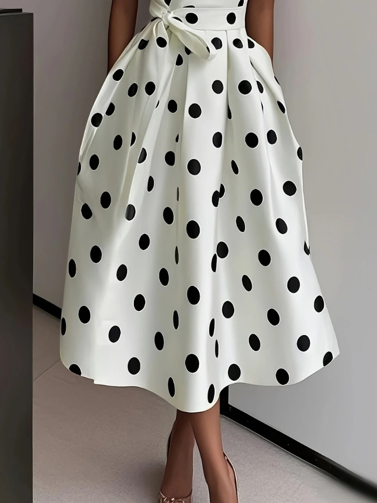 Dames mouwloze wikkeljurk met V-hals, stippenpatroon, ceintuur en midirok