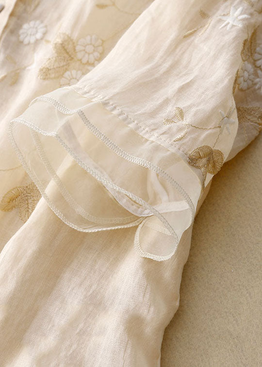 Dames geborduurde tuniekblouse met ronde hals en doorlopende knoopsluiting en transparante gelaagde zoom