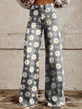 Damesbroek met wijde pijpen, bloemenprint, hoge taille en knoopsluiting