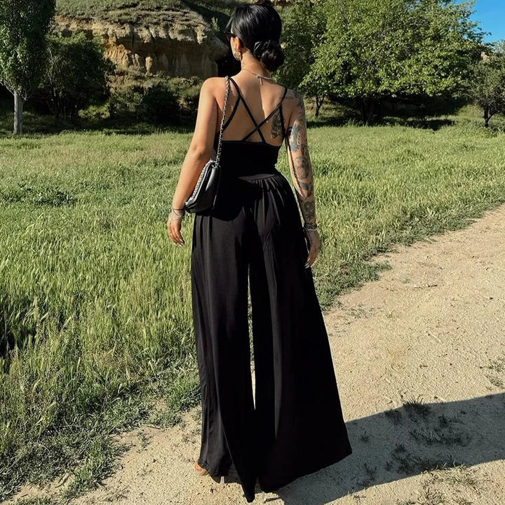 Dames jumpsuit met spaghettibandjes, V-hals, gekruiste rug en wijde pijpen