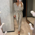Damen Langärmliger Pailletten-Jumpsuit mit tiefem V-Ausschnitt und Bindegürtel