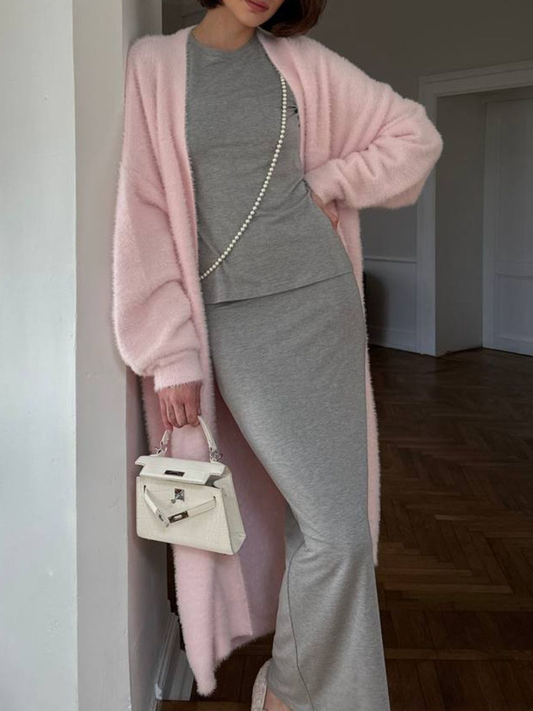 Dames lang vest met open voorkant en pluizige afwerking