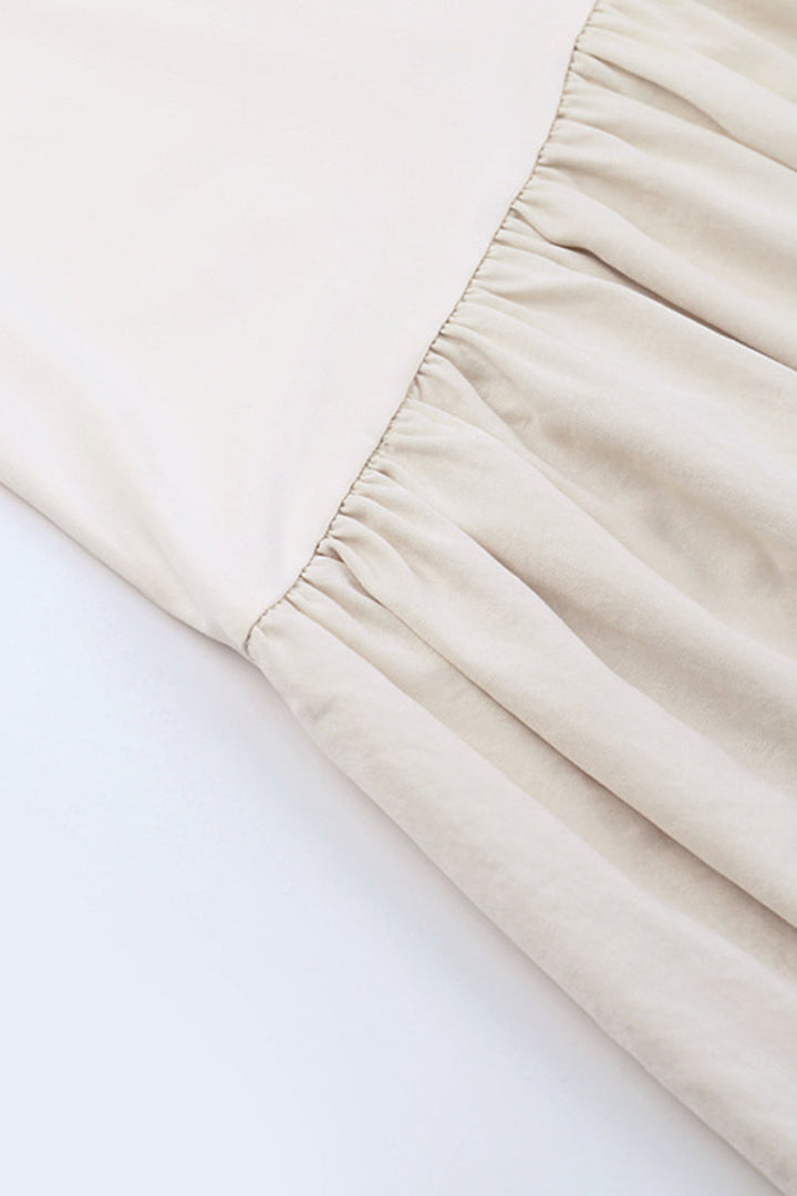 Dames maxi-jurk met off-shoulder mouwen en knoopdetail bij de buste met opening