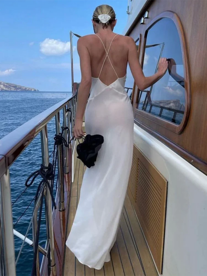 Dames maxijurk met diepe V-hals, spaghettibandjes en bloemenapplicatie