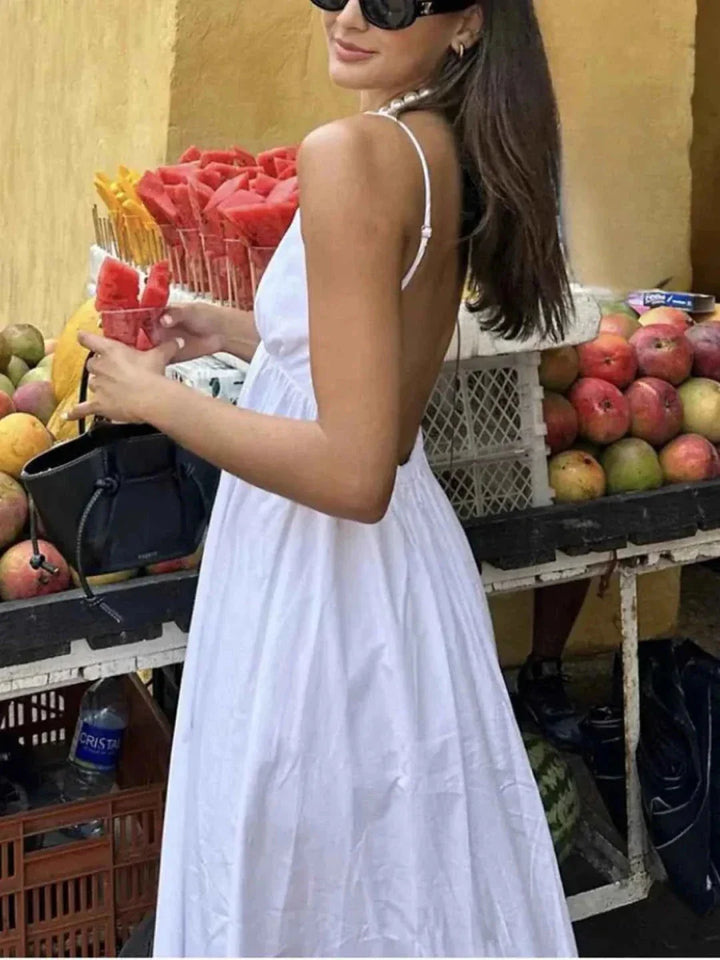 Dames maxi-jurk met diepe V-hals en spaghettibandjes met open rug en wijde rok