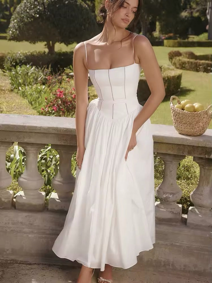 Dames midi-jurk met spaghettibandjes en korsetnaden op het bovenstuk