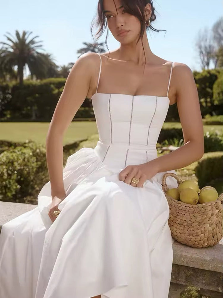 Dames midi-jurk met spaghettibandjes en korsetnaden op het bovenstuk