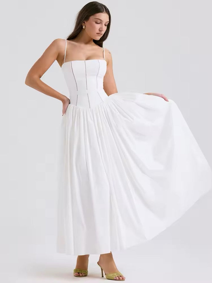 Dames midi-jurk met spaghettibandjes en korsetnaden op het bovenstuk