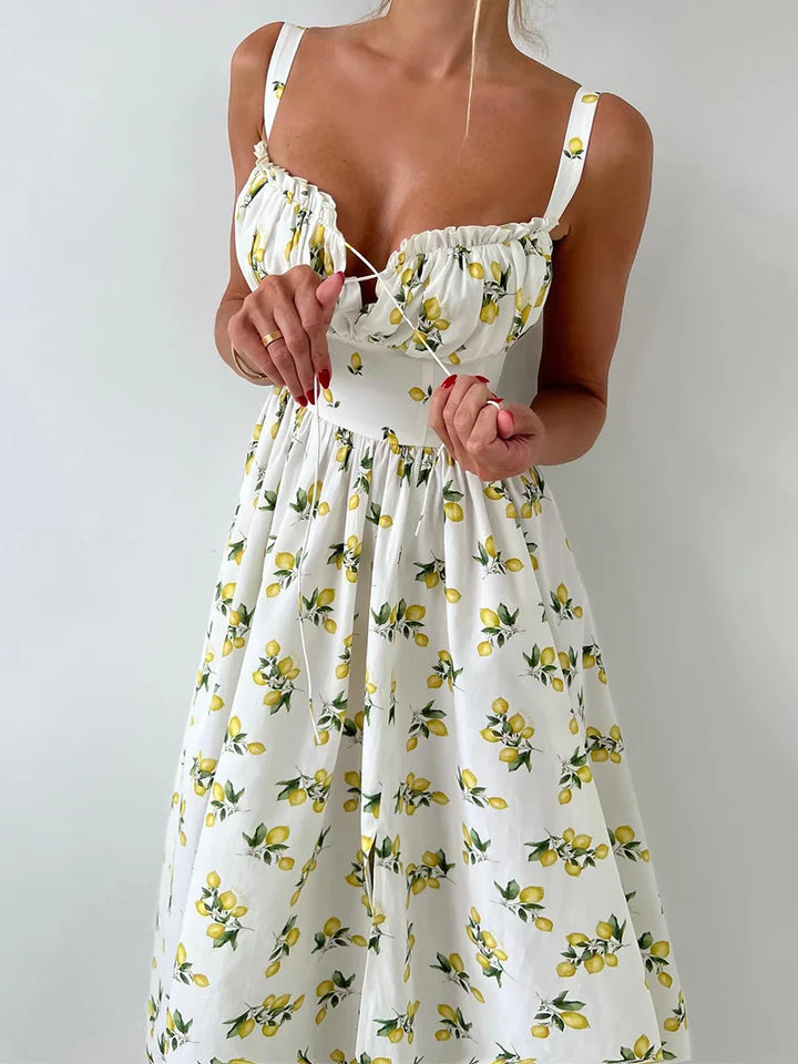 Dames midi-jurk met patroon en hartvormige halslijn met zijsplit en bandjes