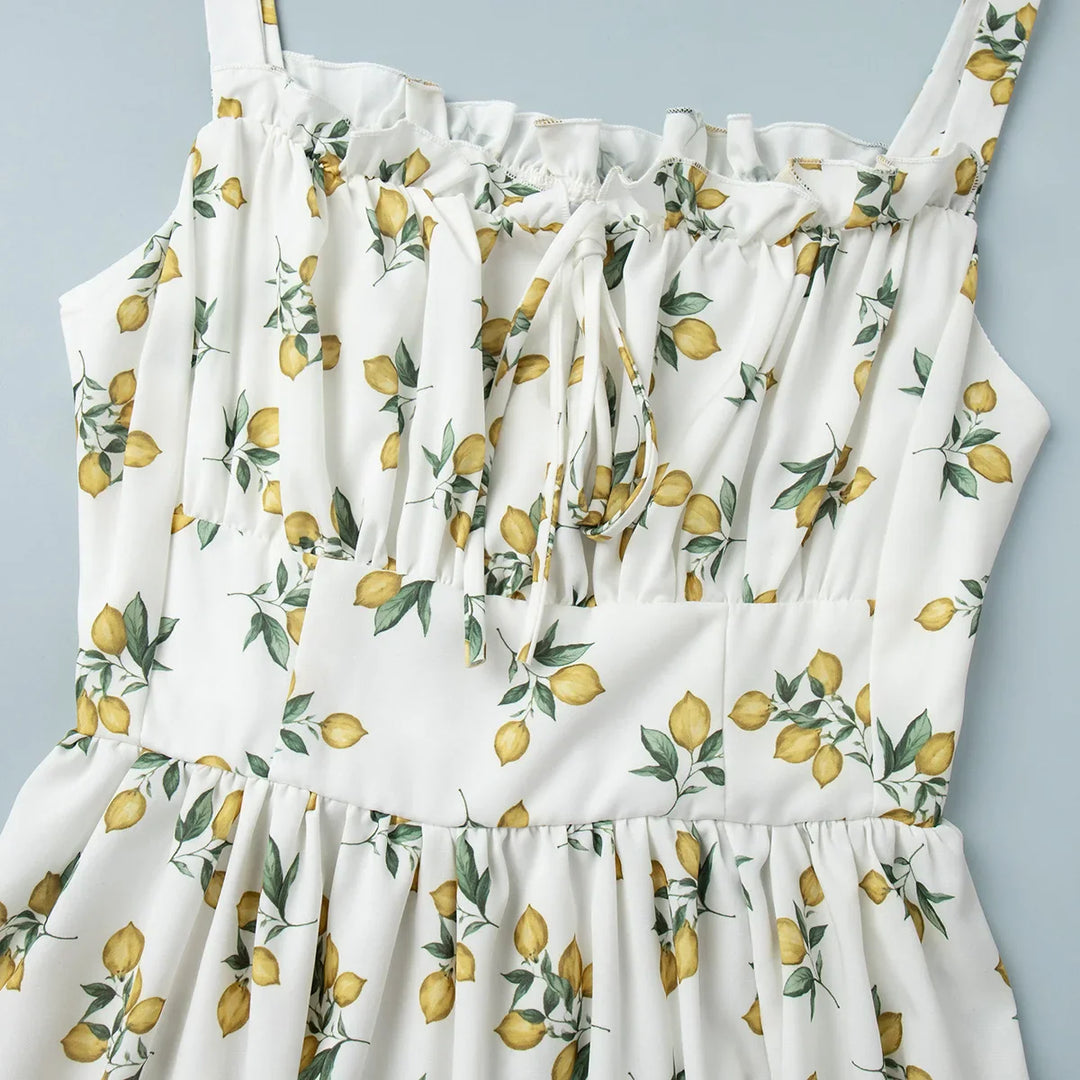 Dames midi-jurk met patroon en hartvormige halslijn met zijsplit en bandjes