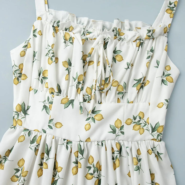 Dames midi-jurk met patroon en hartvormige halslijn met zijsplit en bandjes