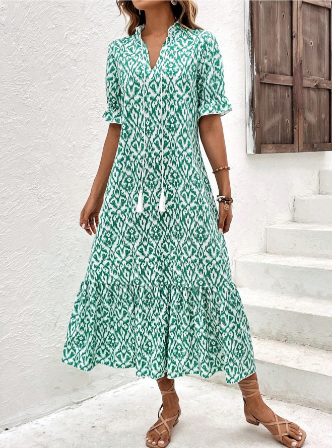 Dames midijurk met V-hals en kwastbandjes, korte pofmouwen en gelaagde rok