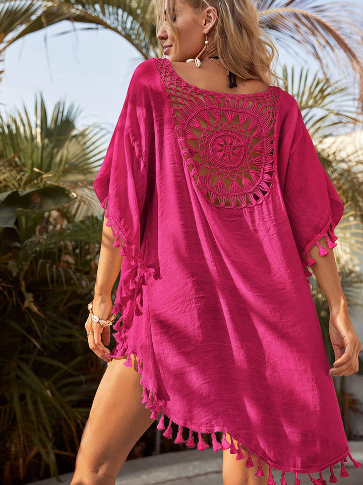 Dames minijurk met haakinzet en kwastjes aan zoom en halflange mouwen