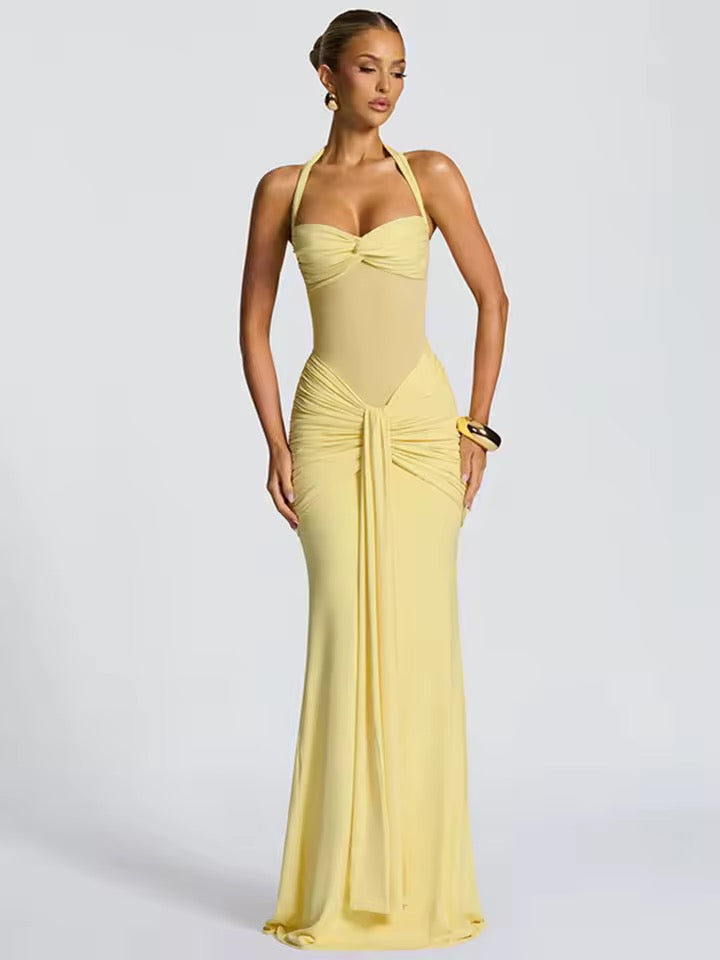 Dames maxi-jurk met halternek, semi-transparant inzetstuk en knoopdetail