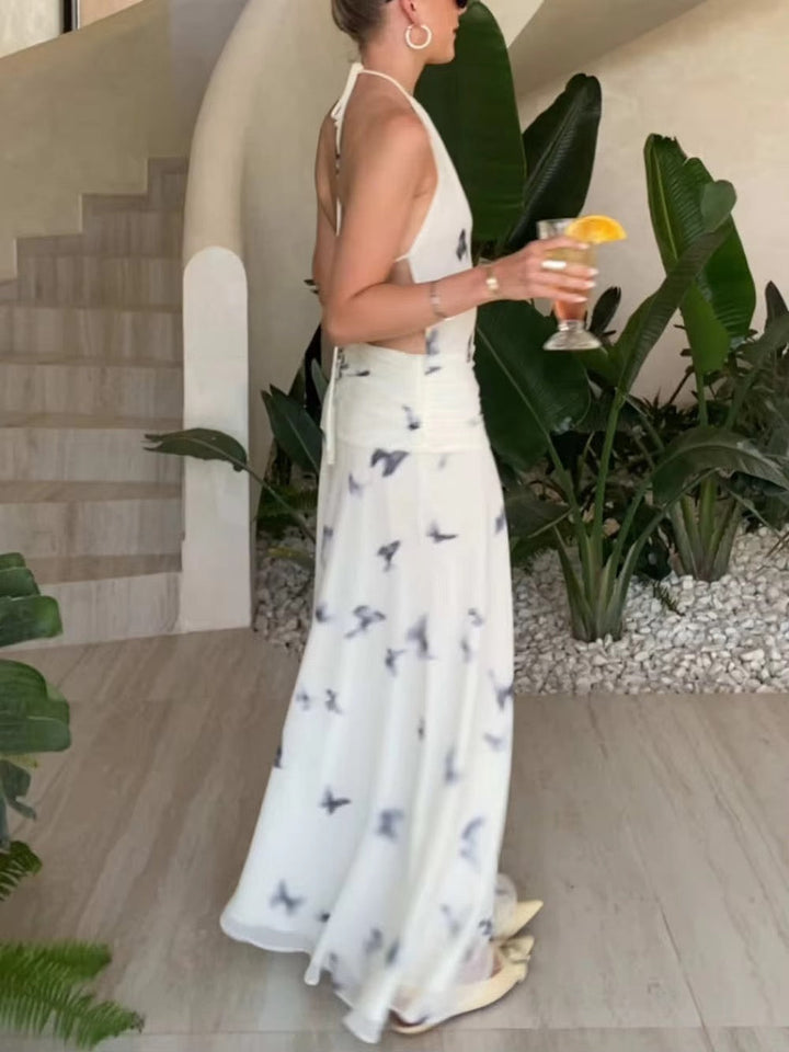 Dames halter maxi-jurk met vlinderprint en open rug met geplooide taille