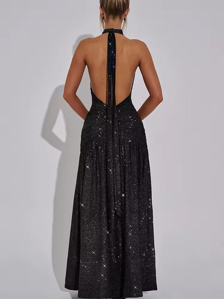 Dames halter maxijurk met diepe V-hals en glitteroppervlak met open rug en zijsplit
