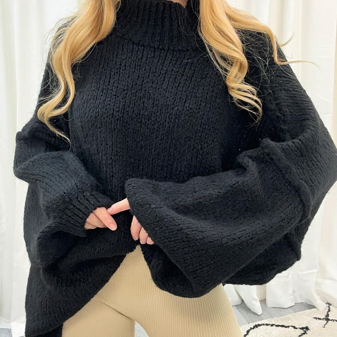 Damespullover met opstaande kraag, ballonmouwen en gestructureerde boorden