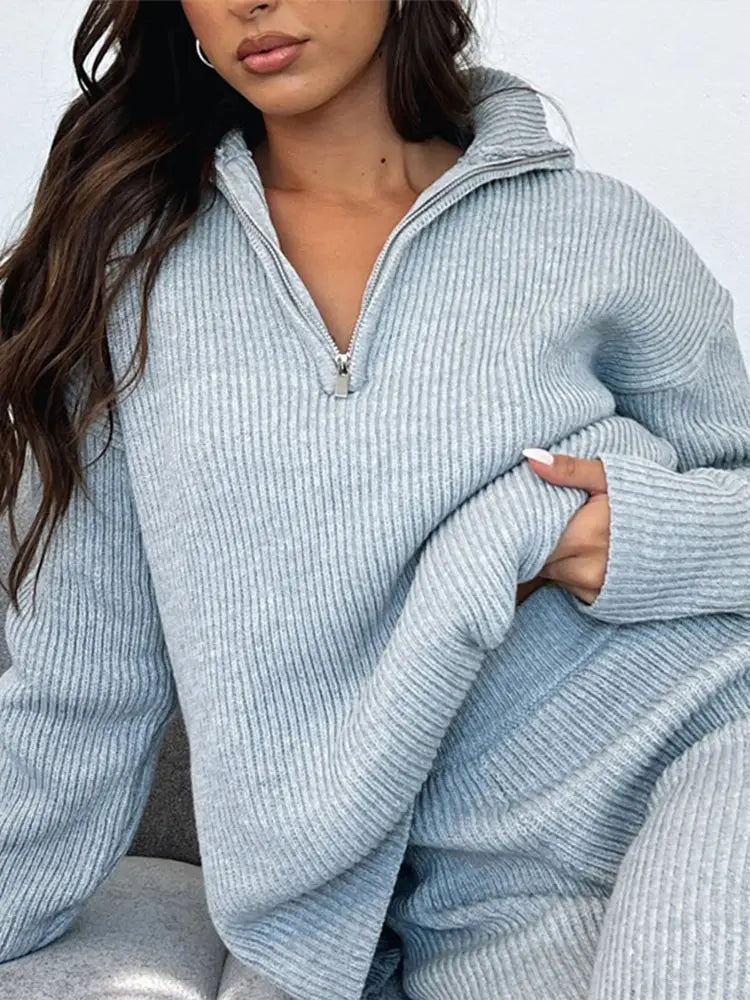 Dames set met pullover met rits en broek met ribstructuur