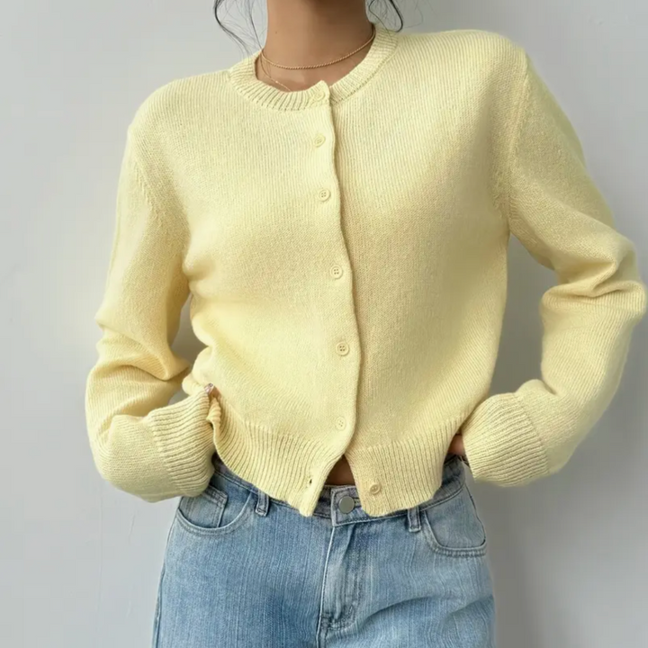 Damesvest met ronde hals, doorlopende knoopsluiting, lange mouwen met geribde boorden op tailleniveau