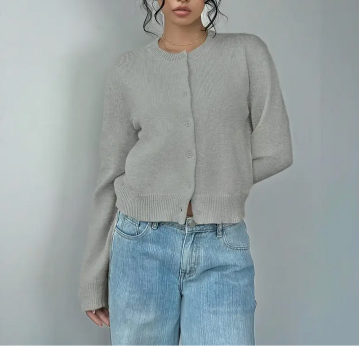 Damesvest met ronde hals, doorlopende knoopsluiting, lange mouwen met geribde boorden op tailleniveau