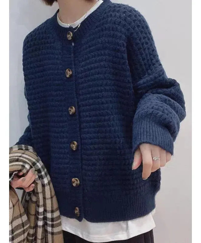 Damesvest met ronde hals, knoopsluiting, ballonmouwen en structuurpatroon