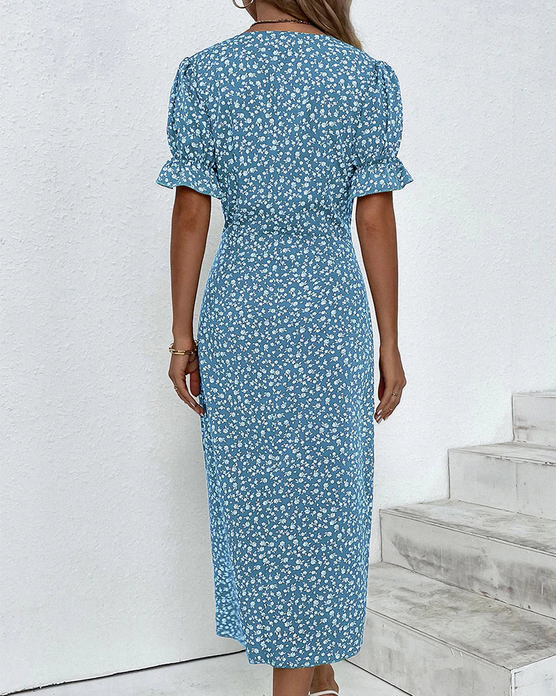 Dames wikkeljurk in midilengte met V-hals, ruchesmouwen, zijdelingse knoopsluiting en bloemenpatroon