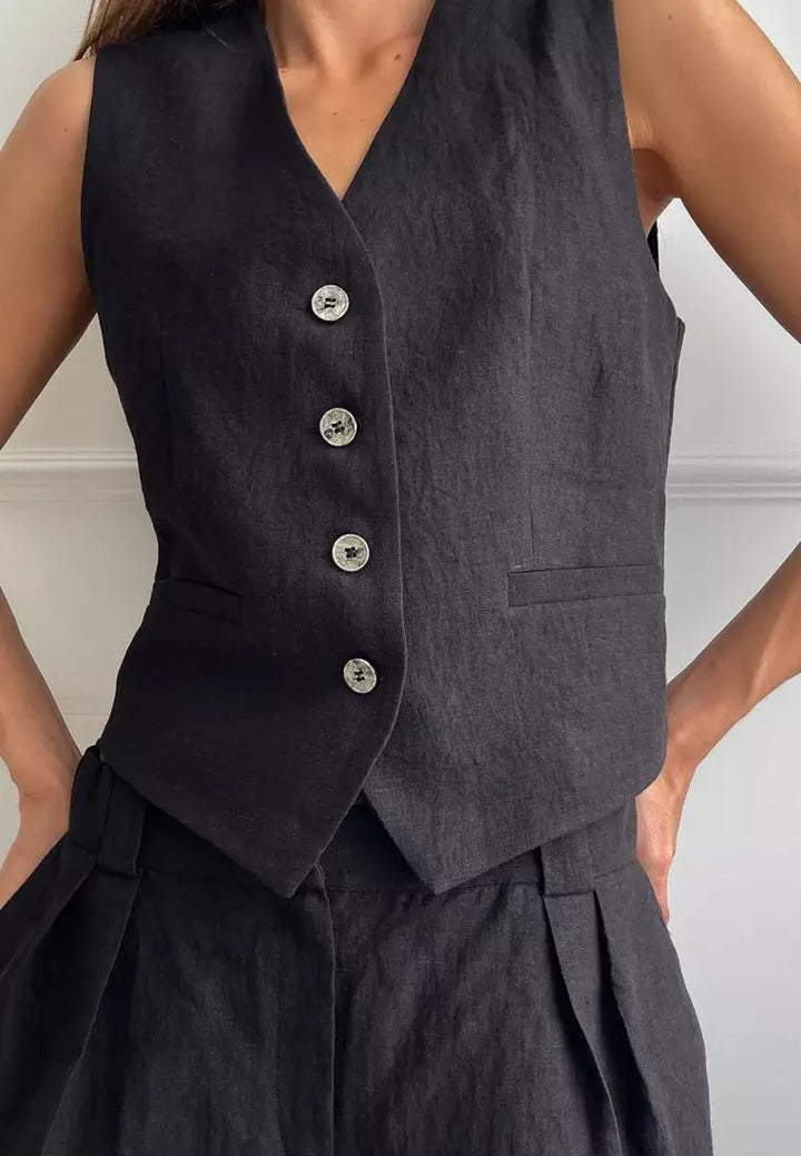 Dames tweedelige set met mouwloze top met V-hals en knoopsluiting en wijde broek