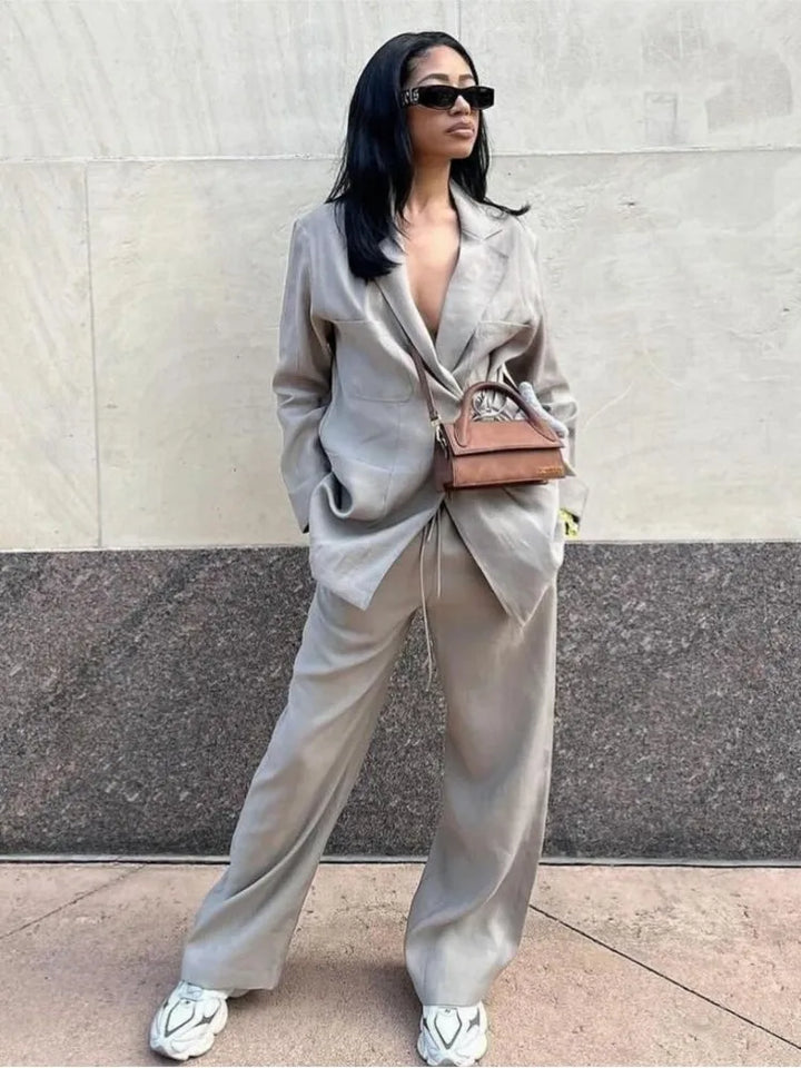 Dames tweedelige set met lange blazer met reverskraag, strikceintuur en wijde broek