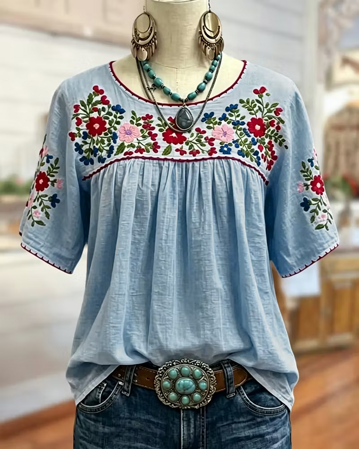 Frieda Damen Bluse mit Blumenstickerei und gerafftem Rundhalsausschnitt – Blau